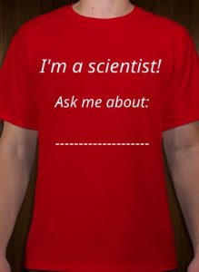 Picture of a red T-shirt with the words: "I'm a scientist! Ask me about: .........."