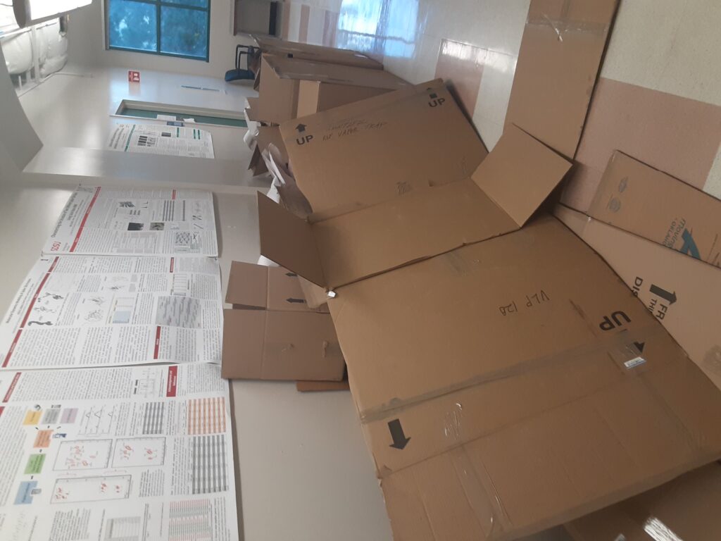 empty cardboard boxes outside lab